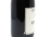 a bottle of wine that is sitting on a table