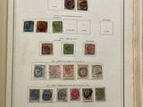 an open book with a bunch of different stamps on it