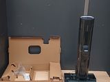 a vacuum that is sitting on a table next to a box