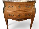 an antique chest of drawers with a marble top on a white background