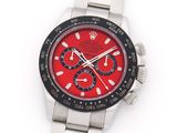 an image of a wrist watch with a red face and black bezel