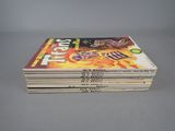 a stack of comics sitting on top of each other on a table