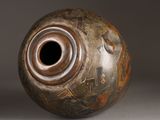 a vase with a hole in the middle of it