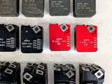 a lot of different type of switches on a white surface