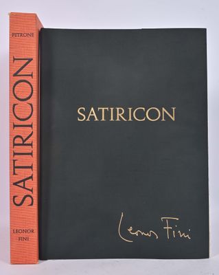 the book is sitting next to a pair of books on a white surface