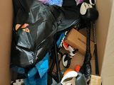 a cardboard box filled with assorted items inside of it