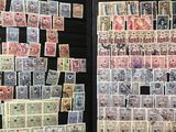 many different types of stamps on display in a case