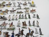a lot of figurines that are on a table