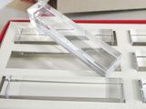 a clear display case with a red lid on a table