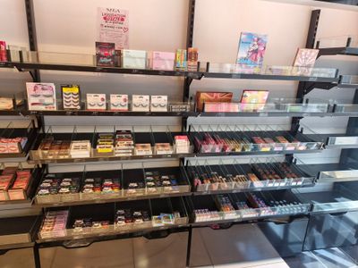 many shelves with various types of cosmetics in the store