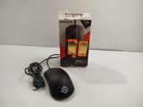 a black mouse and a box on a white surface