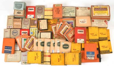 many boxes of cigarettes and cigarettes on a white surface