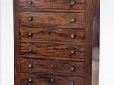 a wooden chest of drawers with five drawers on each side