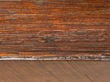 a close up of a wooden table with a clock on top of it