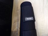 a close up of a black umbrella on a wooden table
