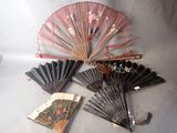 a lot of fans that are sitting on a table