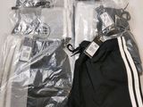 a bag of clothing and a pair of scissors on a table