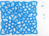 a drawing of a blue flower on a piece of paper