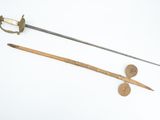 two different types of swords on a white surface