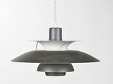 a black and white pendant light hanging from a ceiling