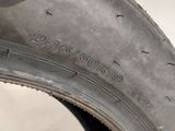 an image of a close up of a tire on a white surface