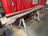a long bench that is sitting in the middle of a room