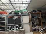an image of a garage with a lot of stuff on the shelves