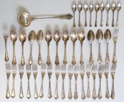 a lot of silver spoons and forks laid out on a table