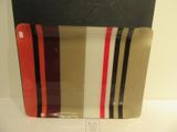 a glass plate with a red, white, and black stripe design on it
