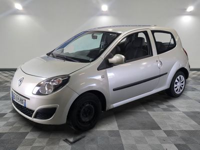 a picture of a small silver car parked on a checkered floor
