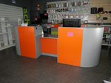 a large orange and grey counter in a store