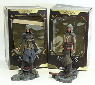 two action figures of a man with a sword and a woman with a sword