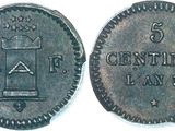 a close up of a coin with a crown on top of it