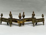 a bronze sculpture of three birds on a bench
