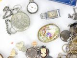 many different types of jewelry on a white surface
