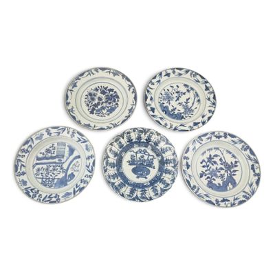 six blue and white plates with flowers on them on a white surface
