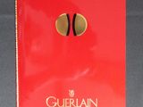 the red book is open on a table with a gold tassel