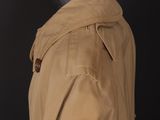 a close up of a mannequin mannequin wearing a trench coat