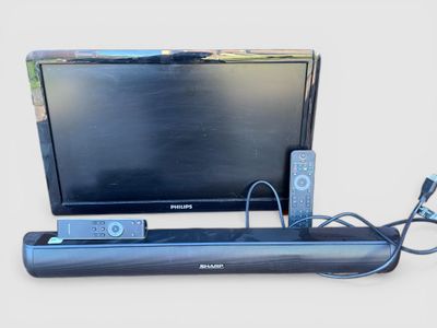 TELEVISION SHARP et bar de son avec télécommande - Photo 1