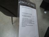 a sign on the back of a chair that says millcome
