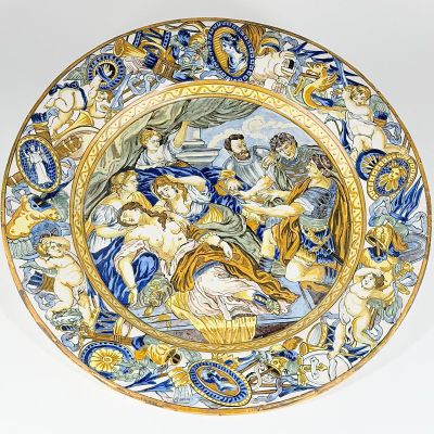 a blue and yellow plate with a painting on it