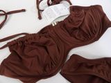 a brown bikini with a pair of glasses and a pair of eyeglasses