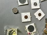 a lot of coins that are on the table