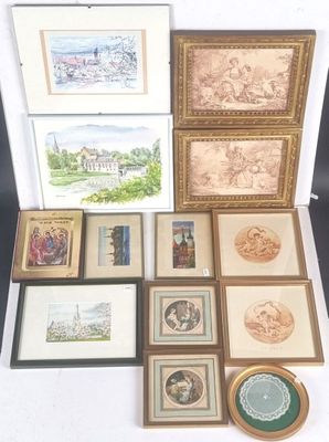 a lot of framed pictures and pictures on the table