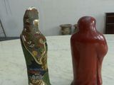 two vases that are sitting on a table