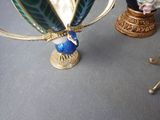 two vases that are sitting on a table