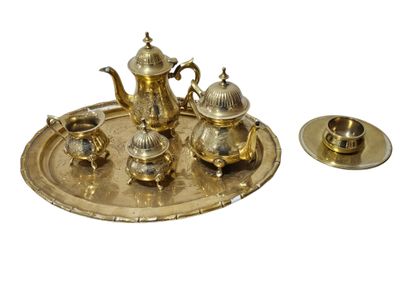 a silver tray with a silver tea set on it