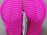 a close up of a pair of pink children ' s shoes