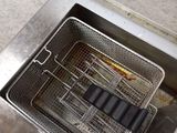 a deep fryer that is sitting on a counter