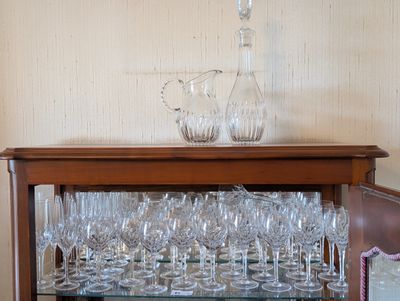 a glass display case with wine glasses on it